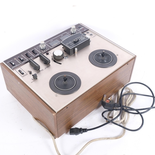 255 - An Akai 4000DS MK-II reel to reel tape recorder, wood finish with associated power cables, untested