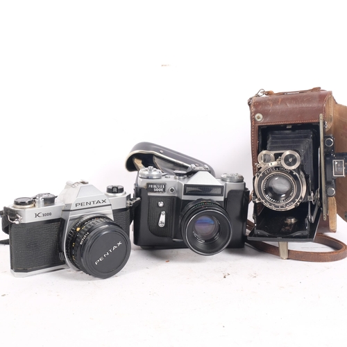 284 - A selection of Vintage cameras and equipment, including a Zeiss Ikon Compur-Rapid folding camera, se... 