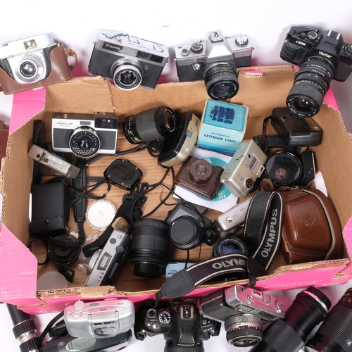 297 - A quantity of Vintage cameras and associated equipment, including a Praktica Super TL2, a Vivitar V3... 