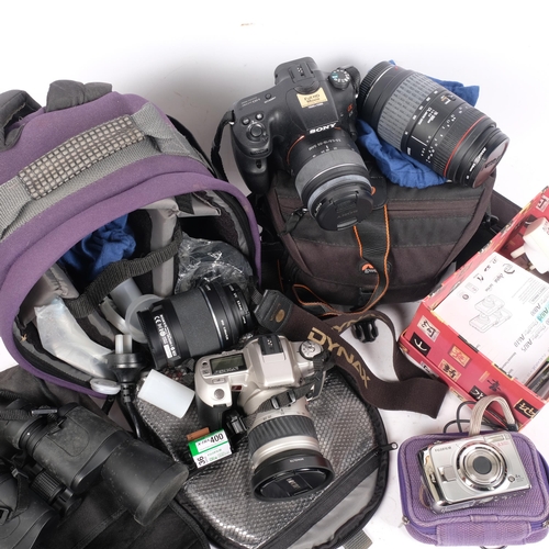 306 - A selection of Vintage cameras and equipment, including a Minolta 505SI Super in associated carry ca... 