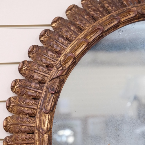 326 - A large circular wall mirror, in a carved giltwood acanthus leaf frame, diameter 85cm