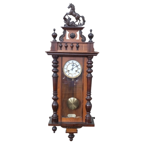 332 - An ornate walnut-cased Vienna regulator wall clock, with carved horse mounted decoration, height app... 