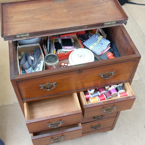 359 - A Vintage mahogany floor standing sewing cabinet, with 6 short and 1 long drawer, with false drawer ... 