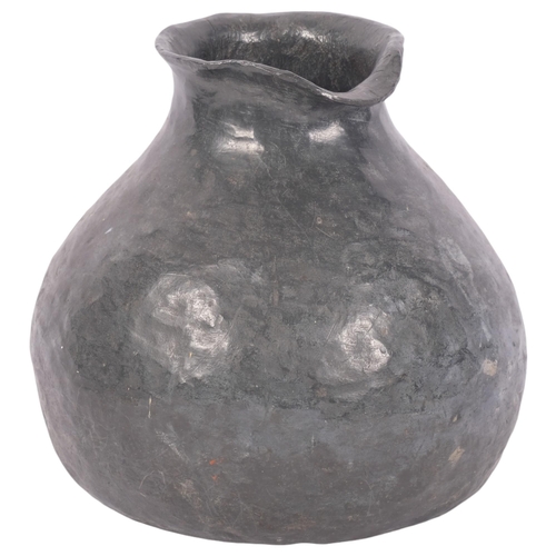 373 - A heavy hammered lead Ethnic pouring vessel, H19cm