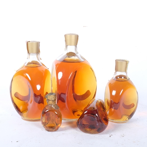 404 - A graduated set of 5 dimple bottles of Haig Scotch Whisky, largest one quart