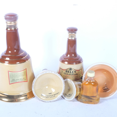 405 - A graduated set of Wade Bell's Old Scotch Whisky, largest 26 and two thirds fluid ounces, and a mini... 