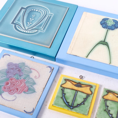 412 - A selection of Art Nouveau style ceramic tiles, various floral decorations, each in modern wooden-ca... 