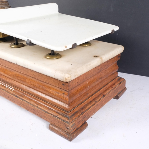 435 - A set of Victorian grocery scales, ceramic and brass weighing plate, with marble top and wooden base... 