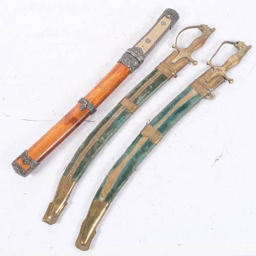 542 - 2 Indian short swords with brass tiger design handle and scabbards, together with reproduction Japan... 