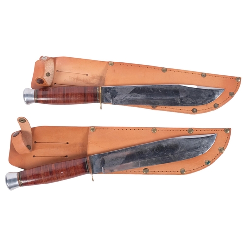 545 - A pair of bowie knives, with tan leather scabbards