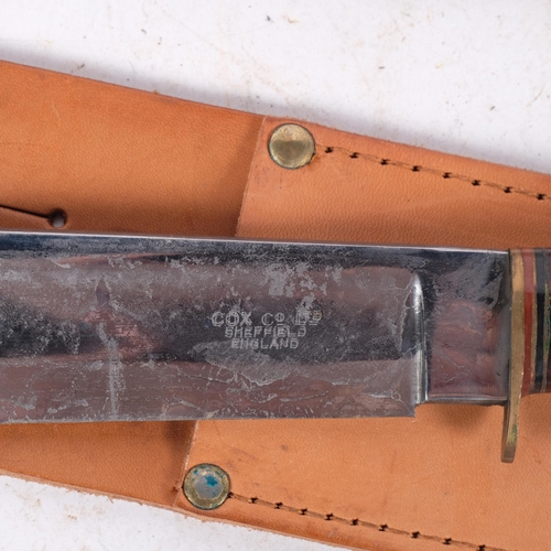 545 - A pair of bowie knives, with tan leather scabbards