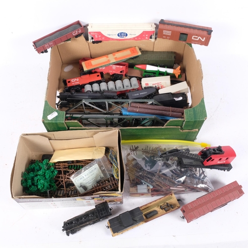 549 - An Atlas HO scale model railway set, with track, wagons, buildings and accessories