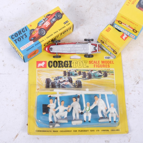 560 - 3 boxed Corgi racing cars, and model figures