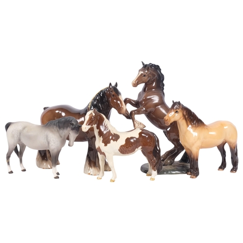 575 - A Beswick rearing horse, 1014, Highland pony, Skewbald and 2 others (5)