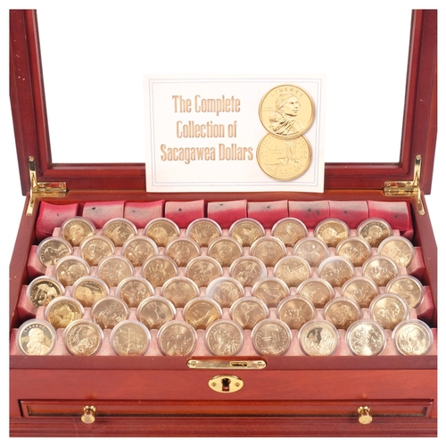 588 - A complete collection of US Mint Sacagawea Dollars, in glazed presentation case