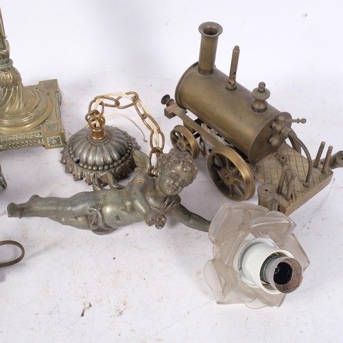 471 - Egyptian figure brass ashtrays, a brass locomotive, candlestick, etc