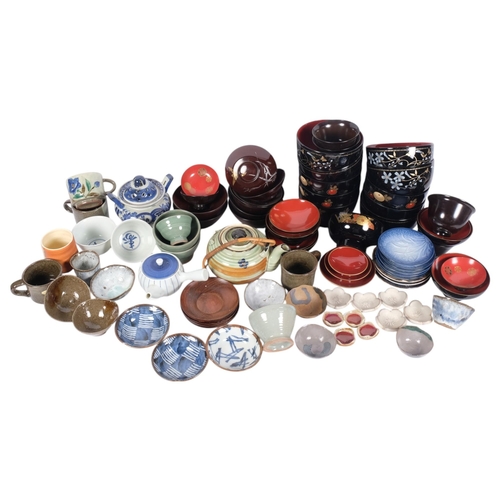 610 - A large quantity of Japanese lacquer and ceramic tea bowls, dishes, teapot, etc