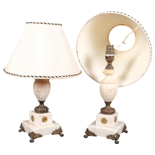 623 - A pair of carved and turned alabaster Vintage table lamps, on 2-tiered plinths, with gilt-metal moun... 