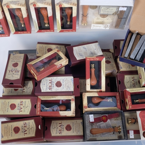 649 - A large quantity of boxed seals and sealing gun wax