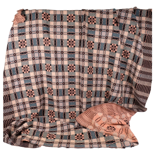 658 - A pink patterned reversible Welsh wool blanket, 208cm x 178cm (A/F)