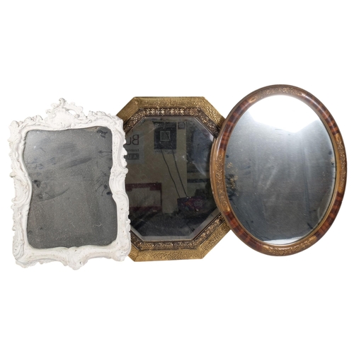 660 - Vintage octagonal mirror in embossed brass frame, 54cm, an oval mirror, and another in painted white... 