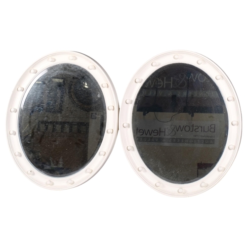 661 - A pair of Vintage oval bevelled-edge mirrors in painted frames, H60cm