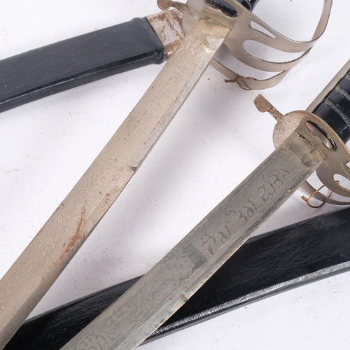 678 - A pair of Indian swords with engraved decoration to the blades, with scabbards, L88cm