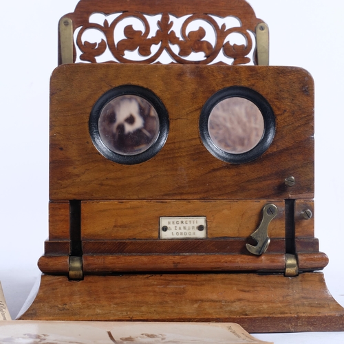 693 - NEGRETTI & ZAMBRA - an ornate Antique table-top stereoscope, with a large quantity of interesting vi... 