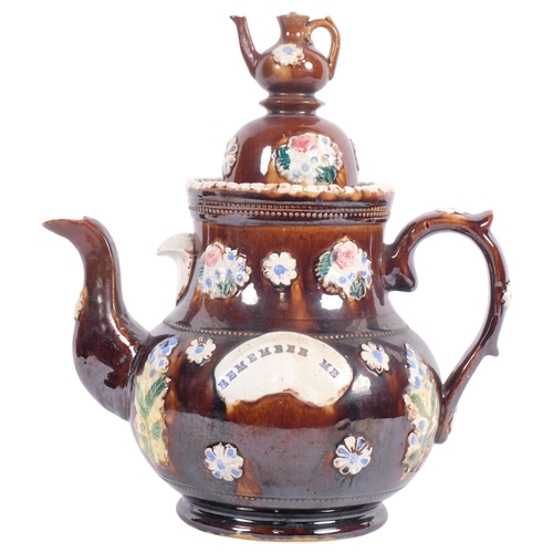 702 - An Antique Barge Ware teapot, with motif 