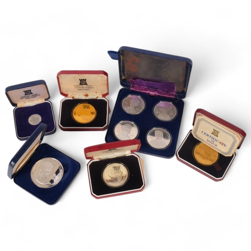 599 - Various Pobjoy Mint commemorative coins in silver, gold plate, and a set of 4 cupro nickel 1977 meda... 