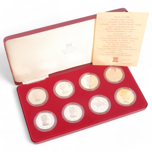 662 - A cased set of Pobjoy Mint 7 crowns in sterling silver, and a Silver Jubilee crown medal