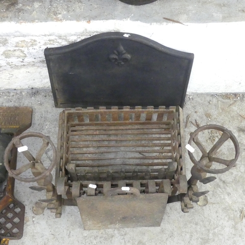 2638 - A cast iron fire back, width 58cm, height 44cm, a ducks nest fire grate, a pair of fire dogs etc.