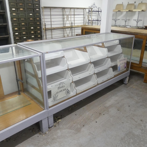 2671 - A vintage haberdashery shop display cabinet, fitted with fourteen slides and with open back. Width 1... 