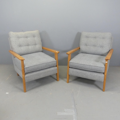 2676 - A pair of contemporary teak and upholstered lounge chairs.