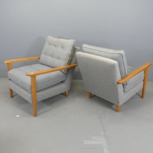 2676 - A pair of contemporary teak and upholstered lounge chairs.