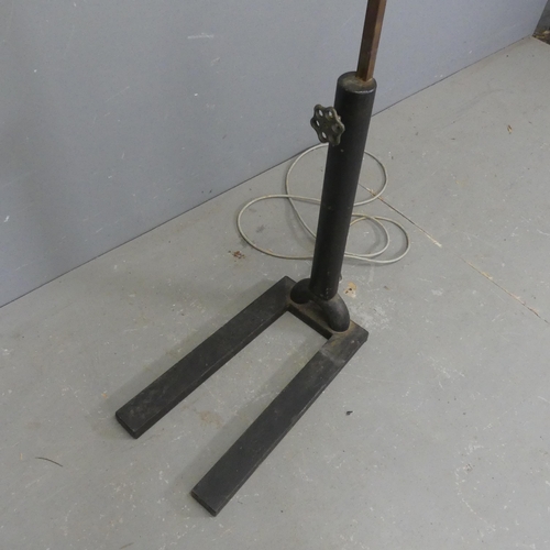 2703 - A contemporary tubular steel arc lamp on industrial cast iron base. Height 172cm.