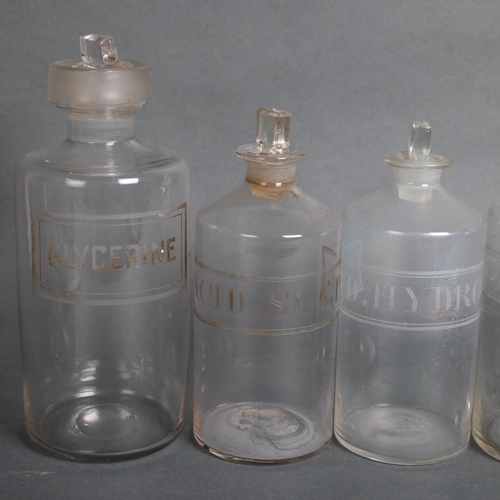 3015 - A group of six clear glass apothecary bottles, each with stopper, all have etched labelling, largest... 