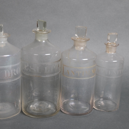 3015 - A group of six clear glass apothecary bottles, each with stopper, all have etched labelling, largest... 