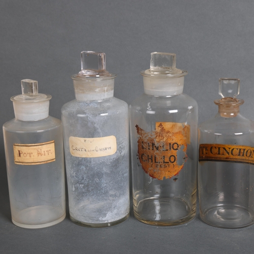 3034 - A group of eight clear glass apothecary bottles, mixed sizes, one very old fine glass bottle, all wi... 