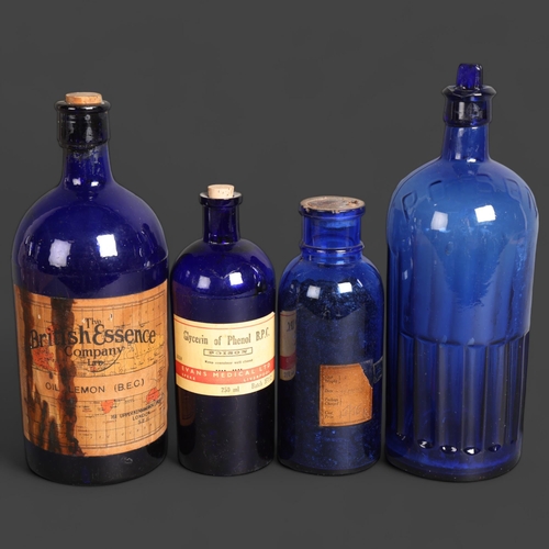 3039 - A group of four blue glass apothecary bottles, including three labelled, example label reads 'Glycer... 