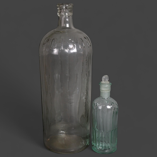 3048 - Two clear glass apothecary bottles, raised moulding to each reads 'Poison', smallest has stopper, la... 