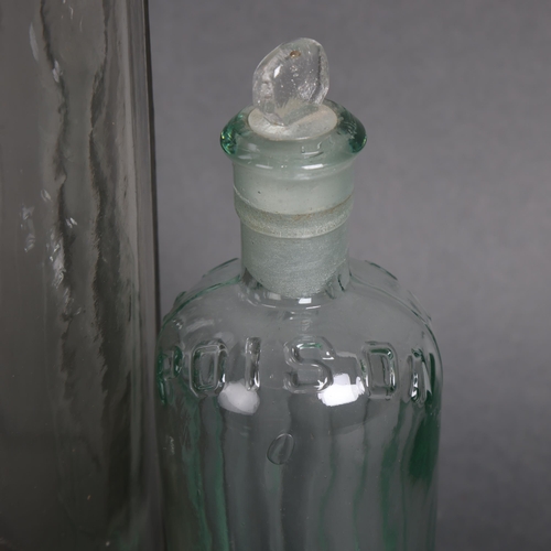 3048 - Two clear glass apothecary bottles, raised moulding to each reads 'Poison', smallest has stopper, la... 