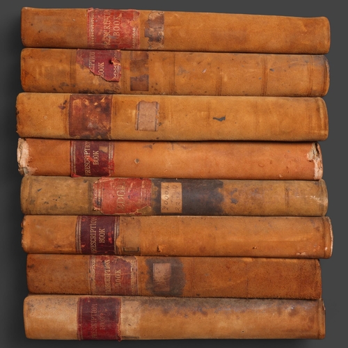 3053 - A group of eight leather bound Chemist prescription books, all largely filled with script dating fro... 