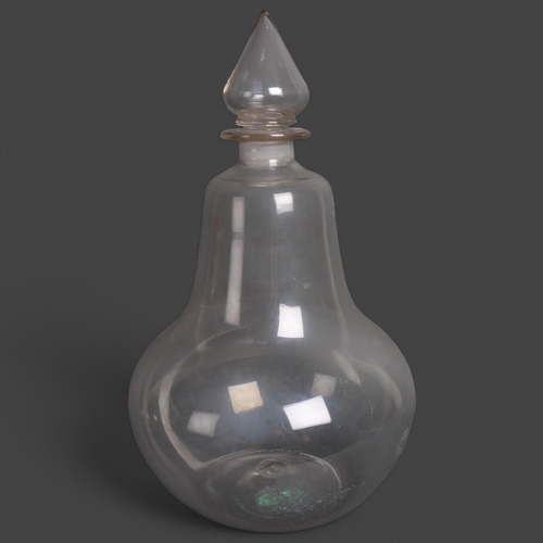 3054 - A large antique bell shaped Chemist bottle with stopper, height 46cm.