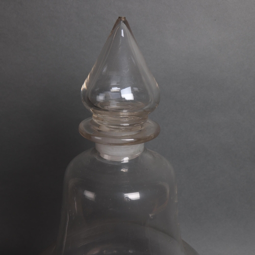 3054 - A large antique bell shaped Chemist bottle with stopper, height 46cm.