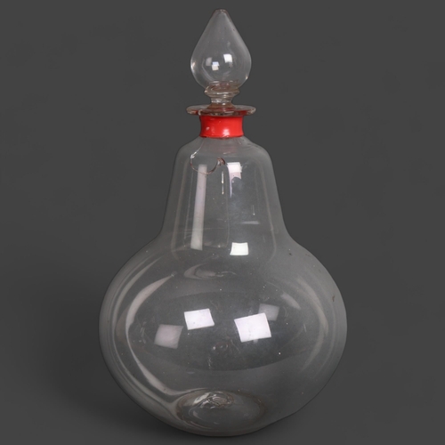 3055 - A large antique bell shaped Chemist bottle with stopper, height 38cm. (A/F).