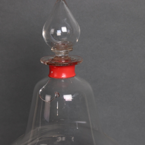 3055 - A large antique bell shaped Chemist bottle with stopper, height 38cm. (A/F).