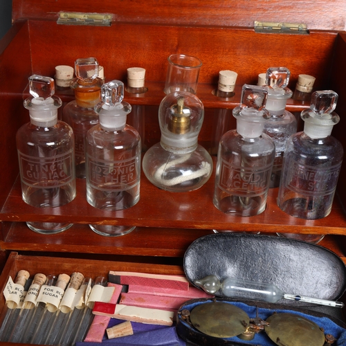 3059 - An antique teak travelling apothecary cabinet, fitted with etched glass bottles and test tubes, alon... 