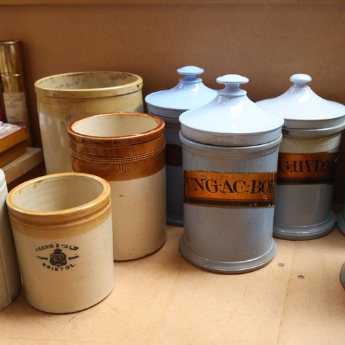 3064 - A group of ceramic apothecary jars, several with gold gilt period labels and associated lids, togeth... 