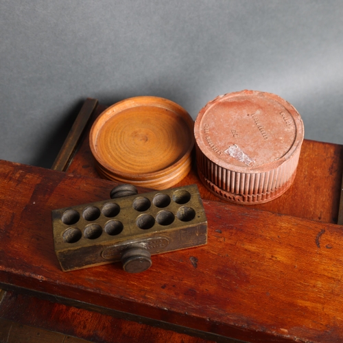 3068 - An antique apothecary pill roller, by Mawson, Son & Son's, with makers label, accompanied by a terra... 